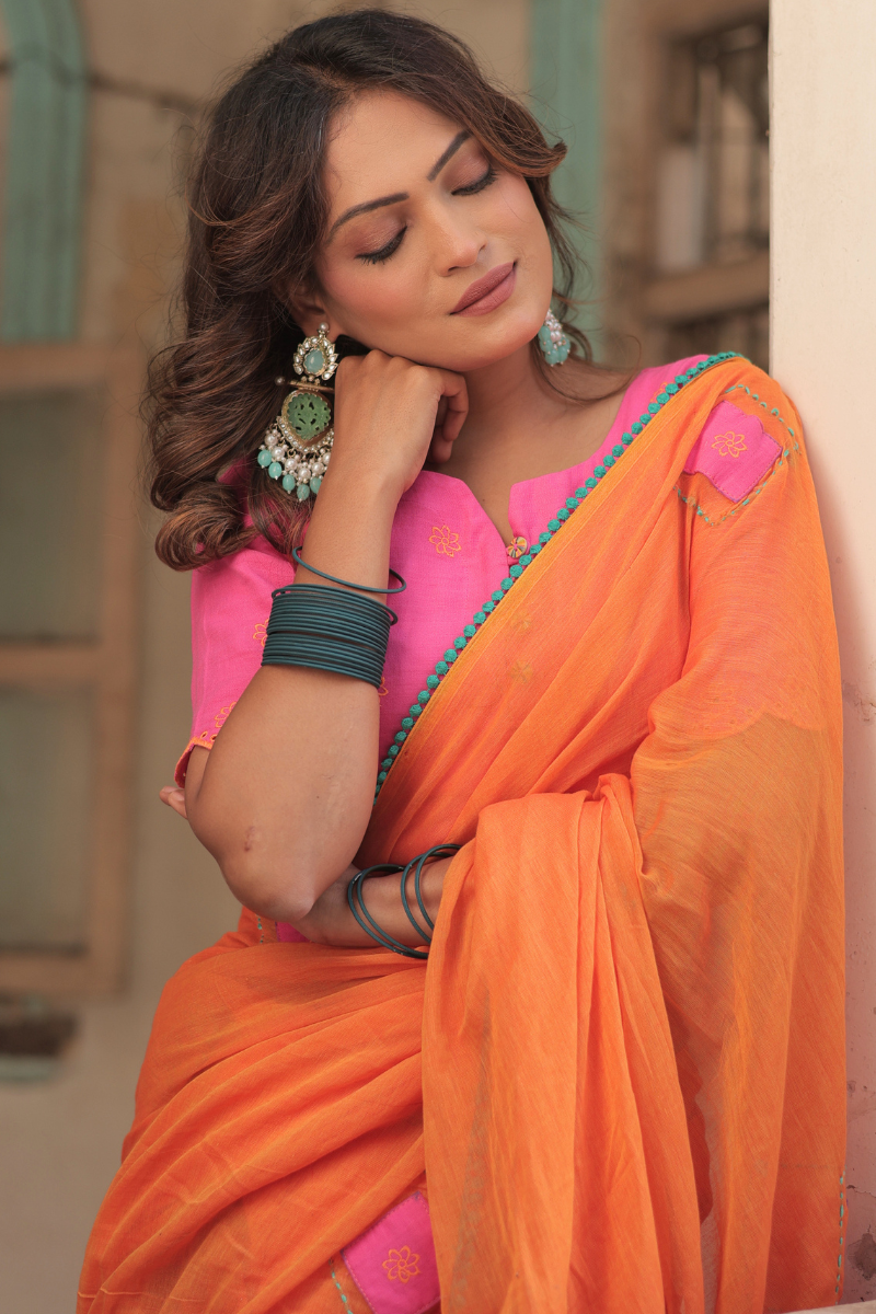 Diya orange mul cotton saree with contrast blouse