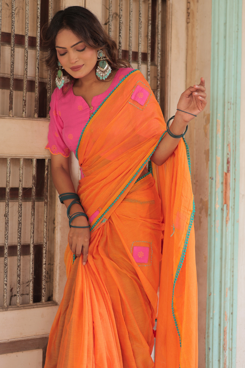 Diya orange mul cotton saree with contrast blouse
