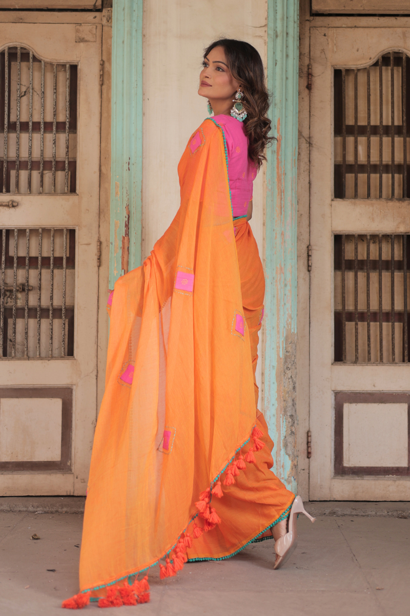 Diya orange mul cotton saree with contrast blouse
