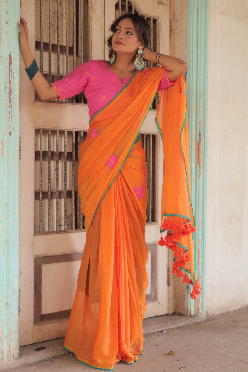 Diya orange mul cotton saree with contrast blouse