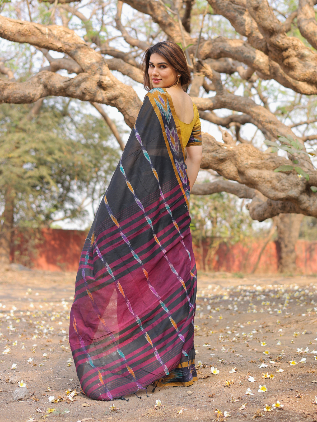 Darsh black ikat weave saree with contrast blouse